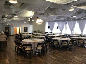 Room shot of tables staged for wedding reception