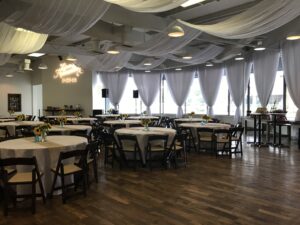 Room shot of tables staged for wedding reception