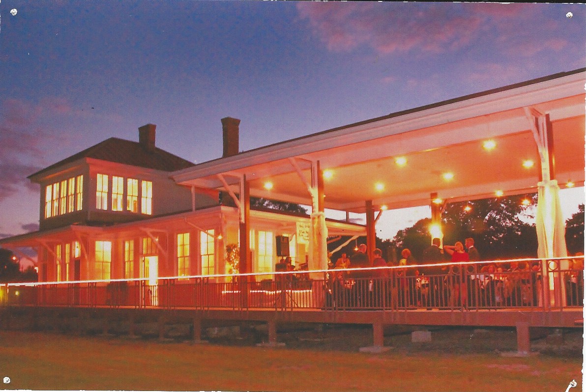 Historic Amqui Station lit up at night during a party