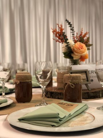Place setting with a light green napkin decoratively folder and placed on a white plate, 660 LaFayette Street Horton Events Downtown Nashville