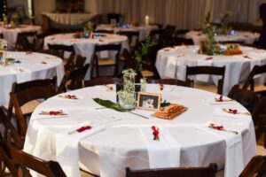 round table with gold cutlery wrapped in red satin ribbon, the Fletcher Wedding 660 LaFayette Street, Horton Events Downtown Nashville round table with gold cutlery wrapped in red satin ribbon, the Fletcher Wedding 660 LaFayette Street, Horton Events Downtown Nashville
