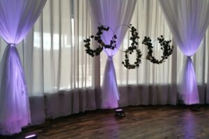 Full length windows with white sheers and a purple light casting from the floor, 600 LaFayette Street, Horton Events Downtown Nashville Full length windows with white sheers and a purple light casting from the floor, 600 LaFayette Street, Horton Events Downtown Nashville