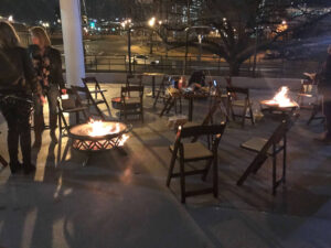 BMG-BR Nashville holiday party at Horton Events Downtown on the patio with metal fire pits and chairs at night