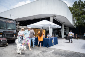 guests walking up to check in booth for fundraiser event