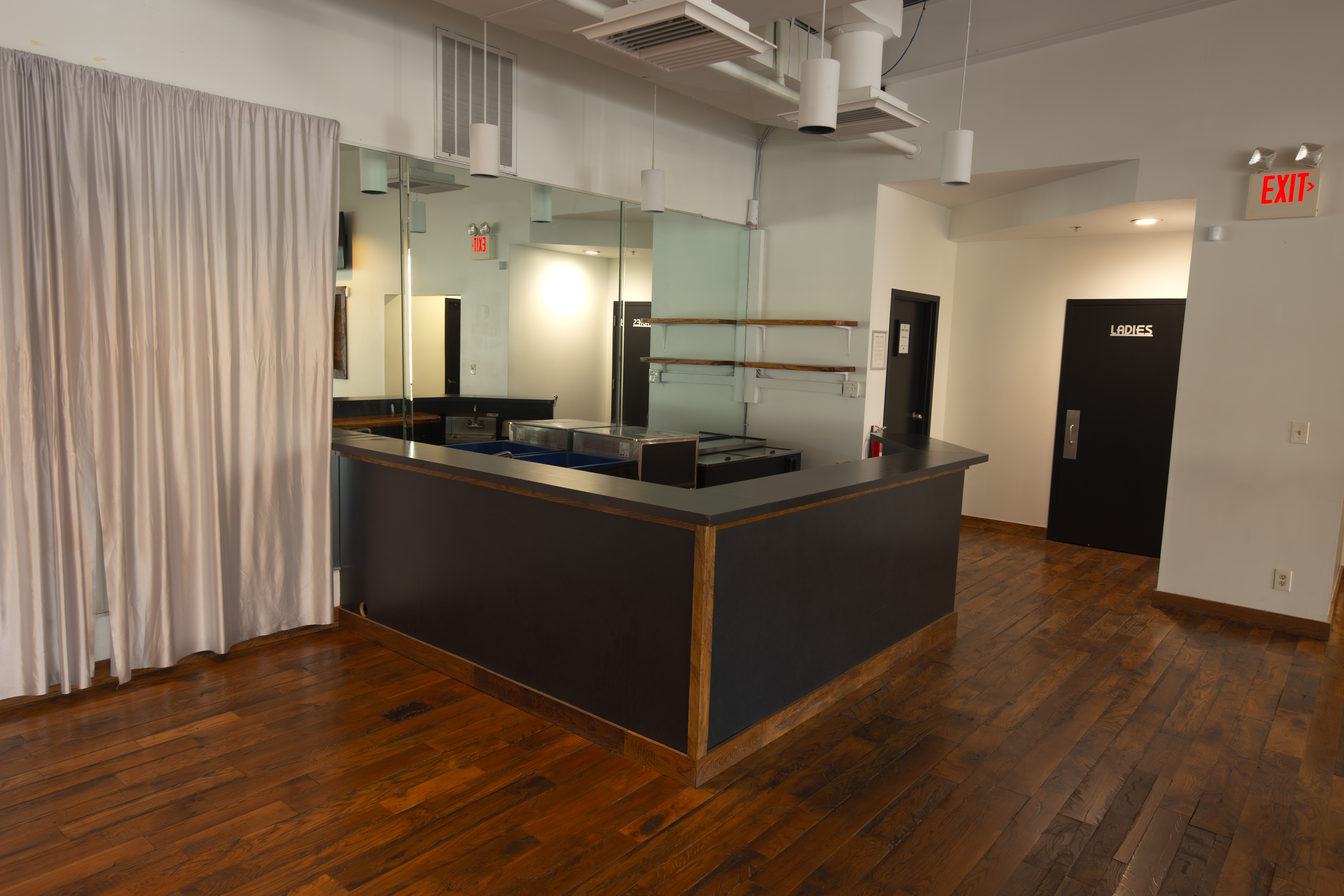 photo of the Main Showroom, including bar & women's restroom door